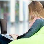 Young girl working on laptop