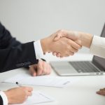 Hr handshaking successful candidate getting hired at new job, cl