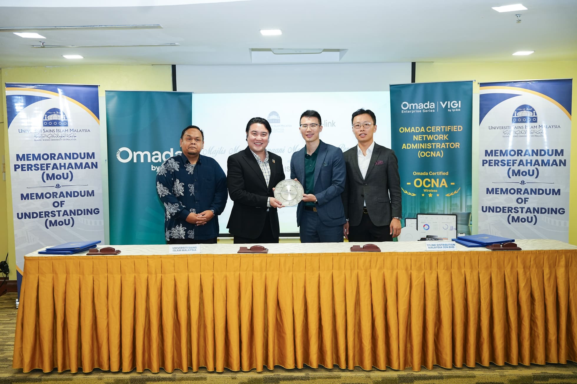 TP-Link Malaysia and Universiti Sains Islam Malaysia (USIM) representatives at the MoU signing ceremony, marking a collaboration to build a structured pipeline of enterprise networking talent